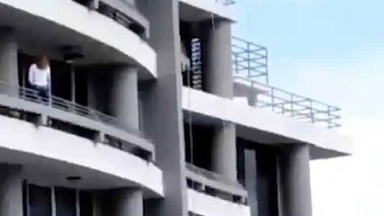 woman falling from building
