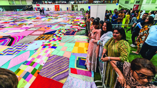 Knitting with love, women weave their way to Guinness World Record