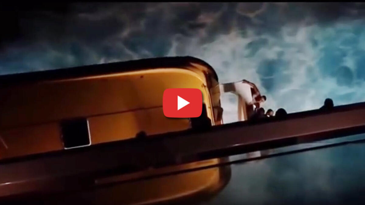 Watch Cruise ship passenger clings for life, falls overboard News