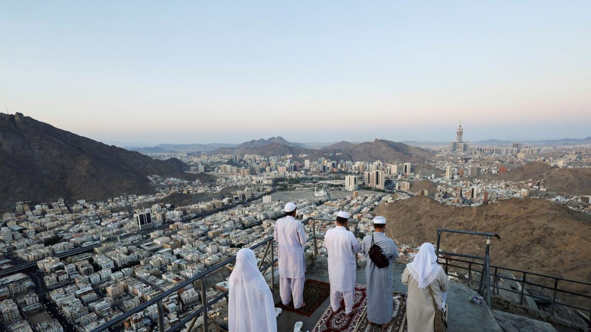 Muslim pilgrims visit Mount Al-Noor, where Muslims believe Prophet Mohammad received the first words of the Koran through Gabriel in the Hira cave, in the holy city of Mecca, Saudi Arabia, July 4, 2022.  Photo: Reuters