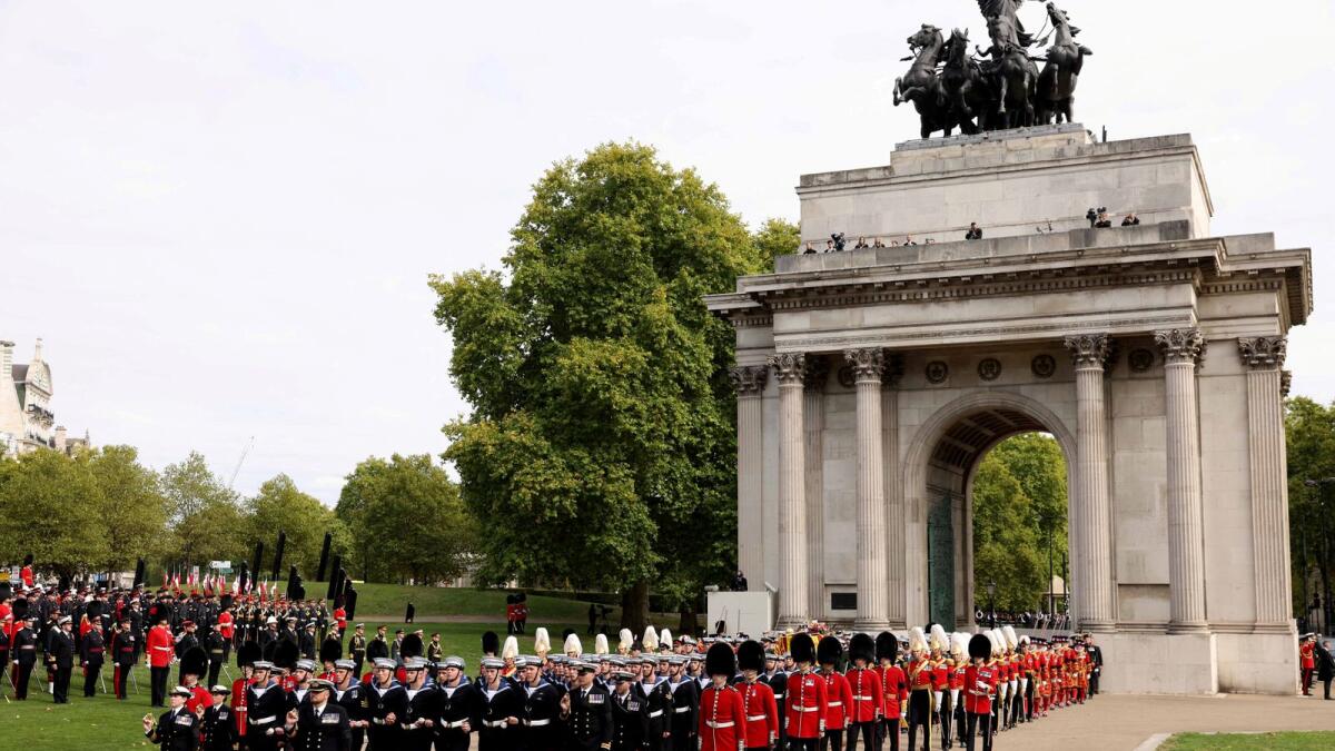 The funeral procession passes through Wellington Arch. The Queen's coffin was then transferred from the gun carriage to a hearse before going on its final journey to Windsor Castle.