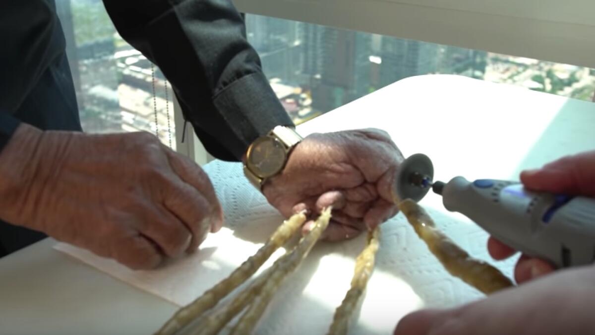 Video: Man with world's longest nails gets them cut with a saw - News |  Khaleej Times
