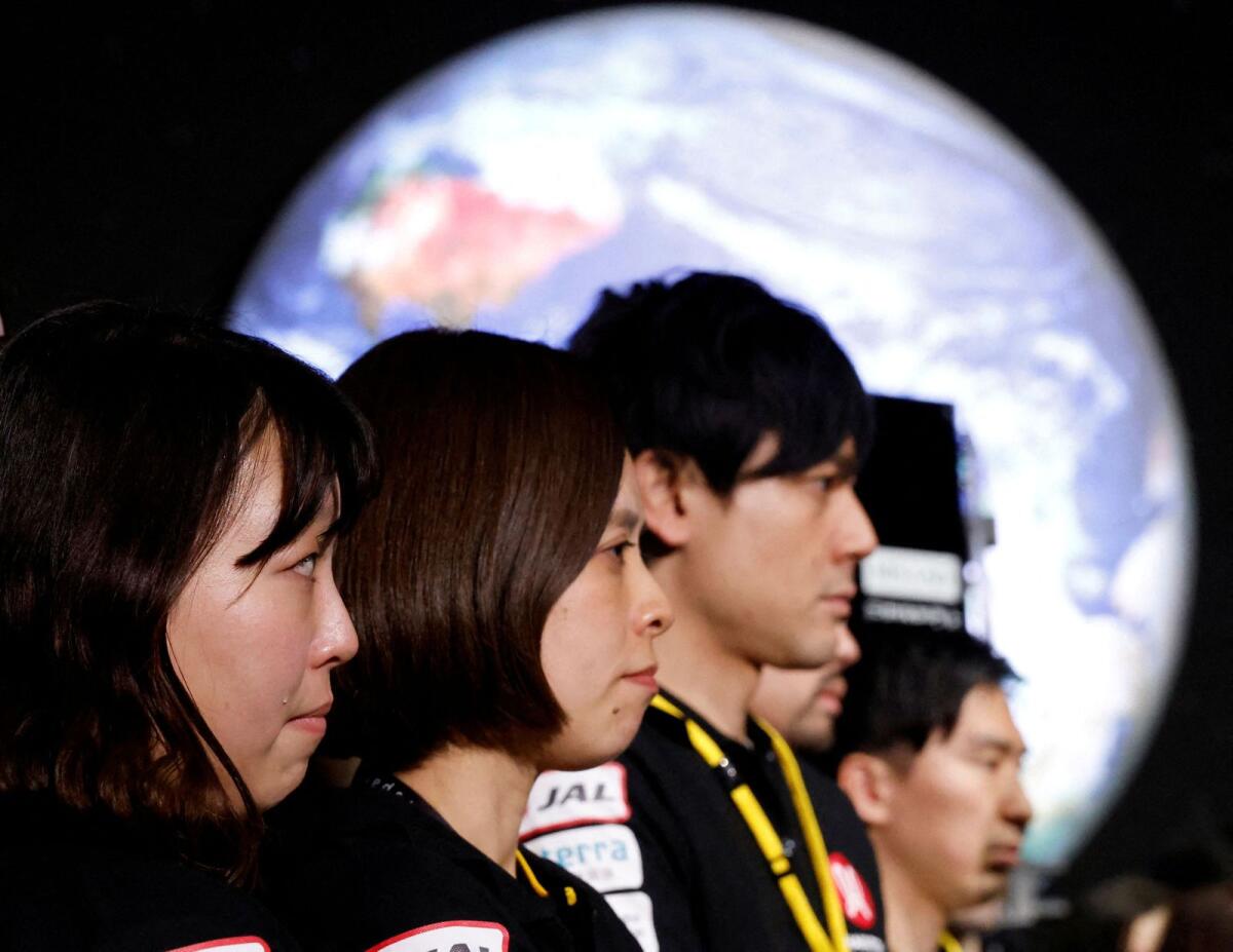 Employees of  ispace react after the company announced they lost signal from the lander. Photo: Reuters