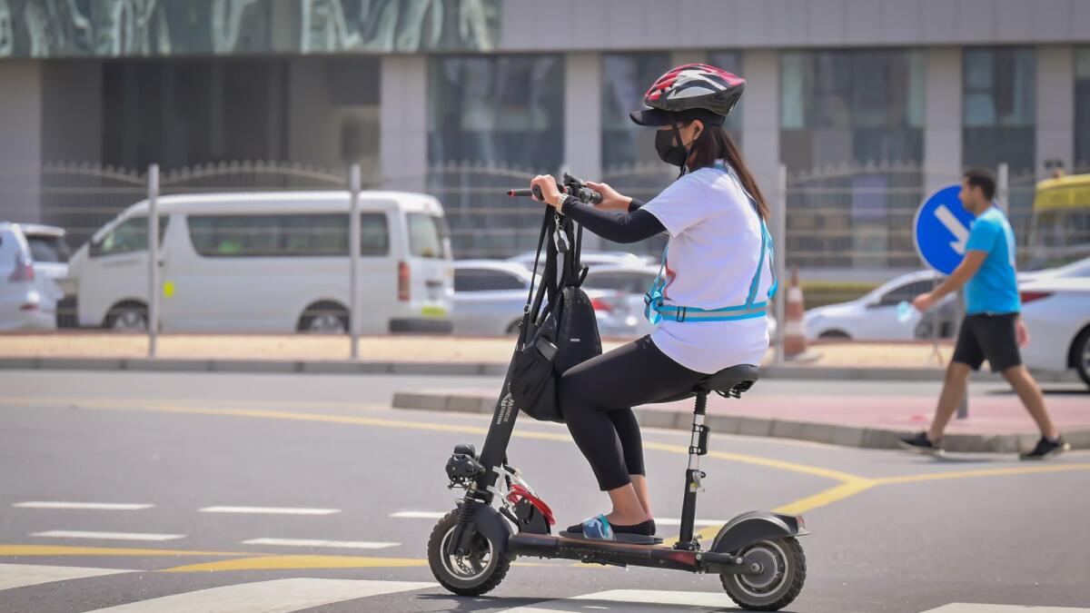 Resident riding an e-scooter. Photo: Rahul Gajjar