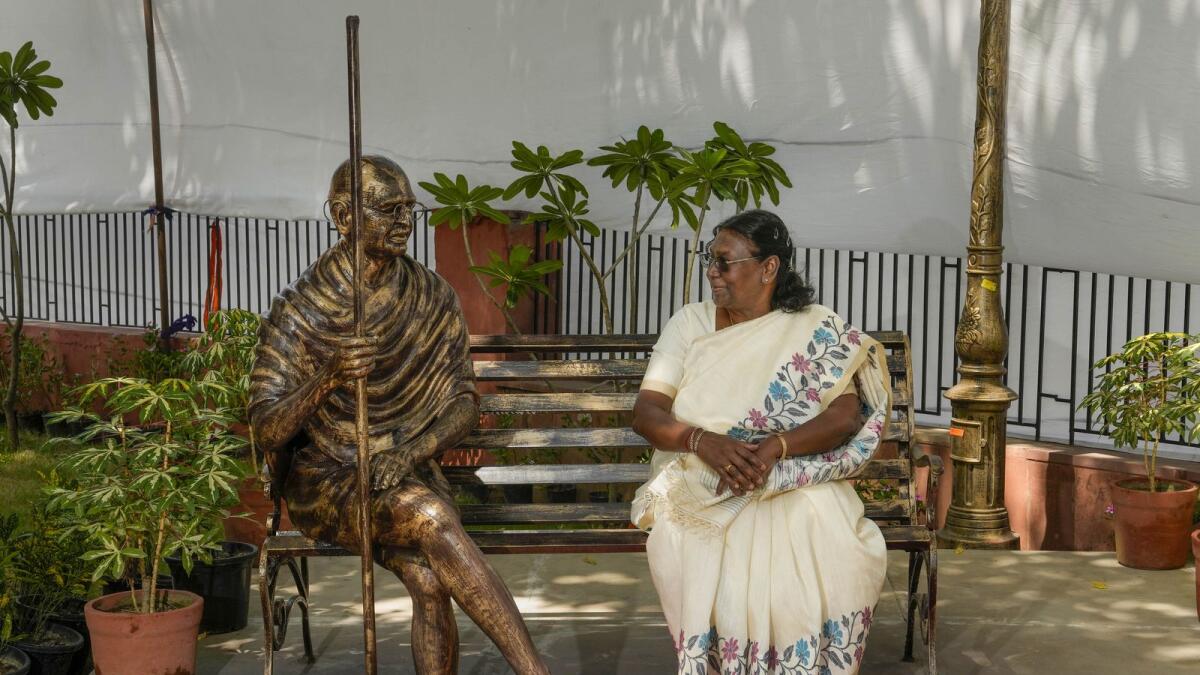 India's President Droupadi Murmu poses for photos during the unveiling of a statue of Mahatma Gandhi and inauguration of 'Gandhi Vatika' near Rajghat ahead of the G20 Summit, in New Delhi on Monday. — PTI