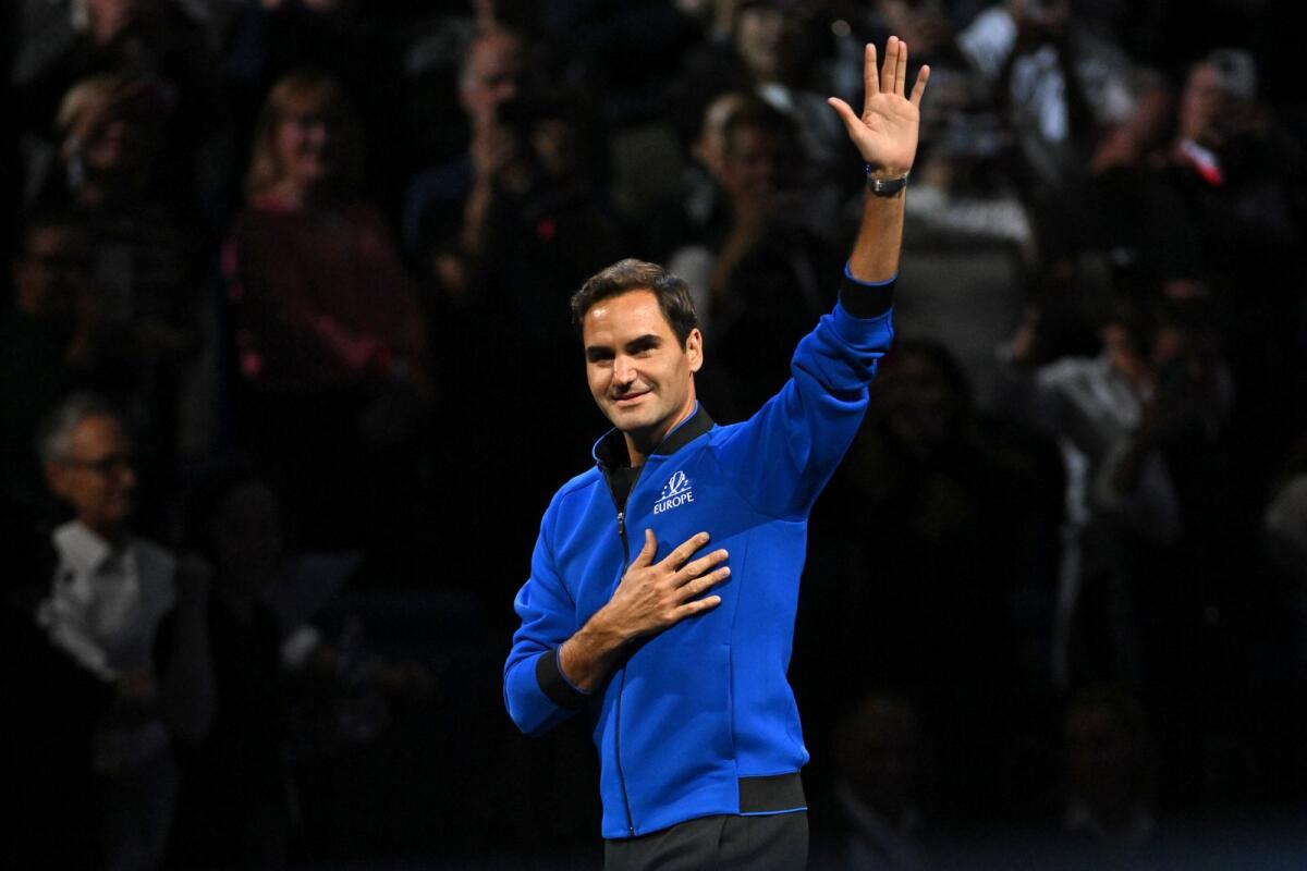 Roger Federer acknowledges the applause as he walks onto court at the O2 Arena in London on Friday. (AFP)