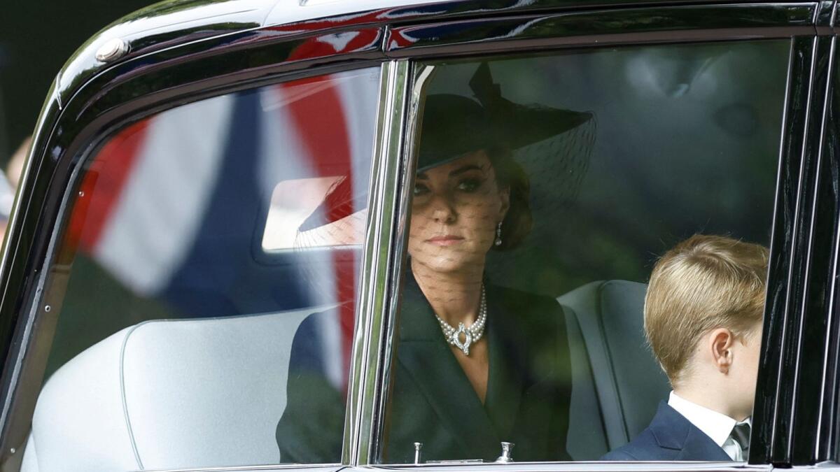 Britain's Catherine, Princess of Wales is seen travelling in a car with Britain's Prince George.