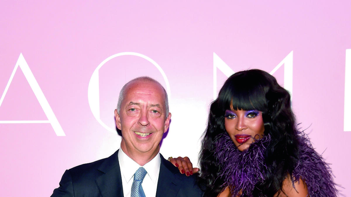 Publisher Benedikt Taschen (L) and model Naomi Campbell celebrate the launch of NAOMI