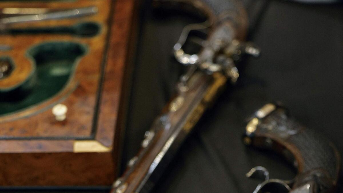 This photograph shows two pistols, which belonged to Emperor Napoleon I, during the preview before their auction on July 7 in Fontainebleau, south of Paris. AFP