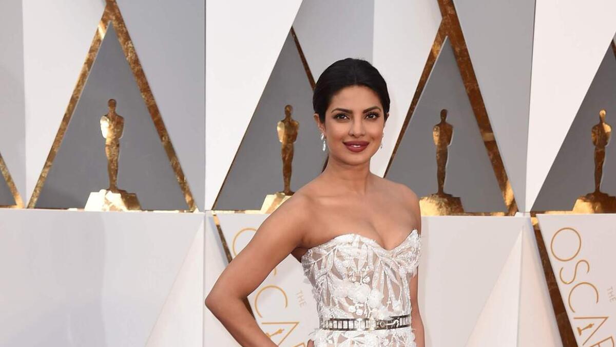 First Indian actress to present at the Oscars, Priyanka Chopra looking ethereal in a white gown.