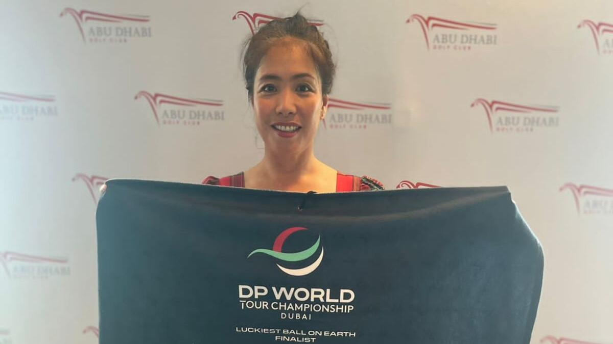 Ladies' Divisional winner Lina Tyson with her winning prize at Abu Dhabi Golf Club. = Supplied photo