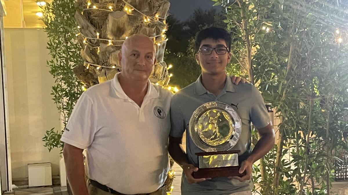 Rayan Ahmed (right) of the Montgomerie Golf Club receiving the inaugural Viggo Sorensen Award for the outstanding junior golfer in the UAE Scratch Golf League 2022 - 23 from Graeme Eglintine (left) of Trump International Golf Club.- Supplied photo