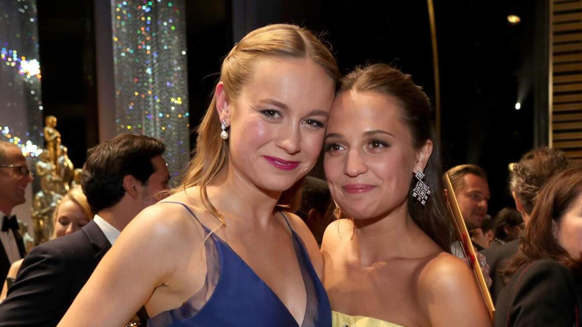 Brie Larson and Alicia Vikander pose with their Oscars