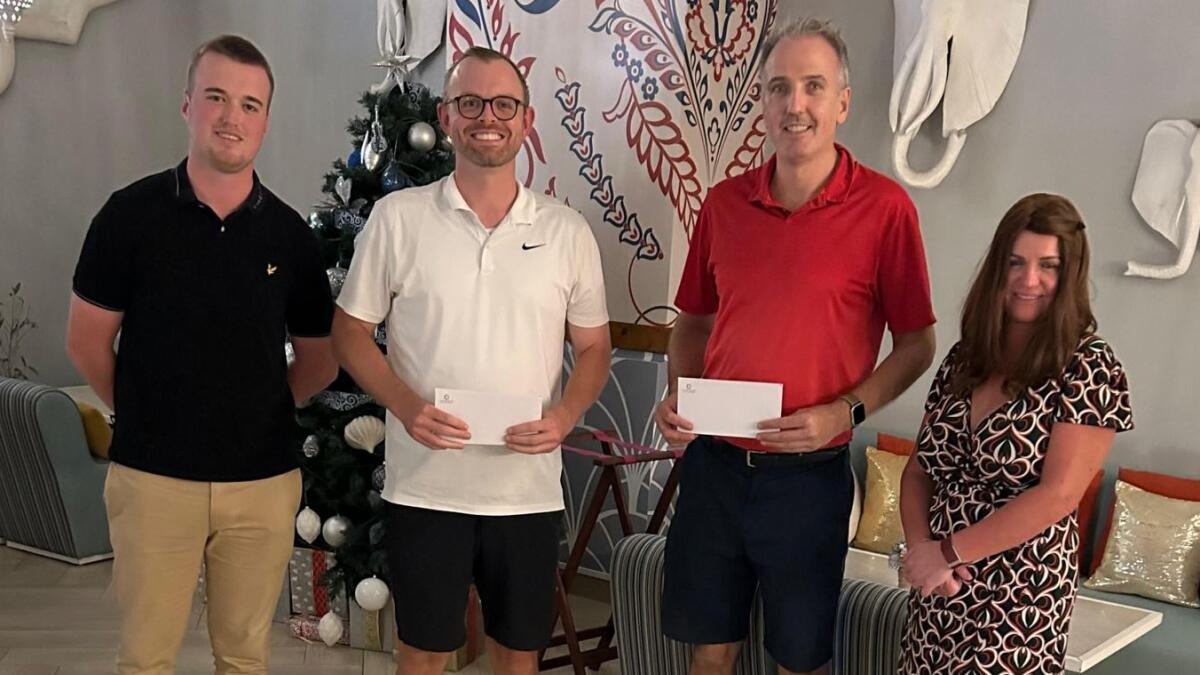 winners of the Thursday Curry Club, Edward McCullagh and Sean Barnes (middle) with Membership Services Executive, Kian Higgins (L) and  Jumeirah Golf Estates Lady Captain, Evelyn Downham. - Supplied photo
