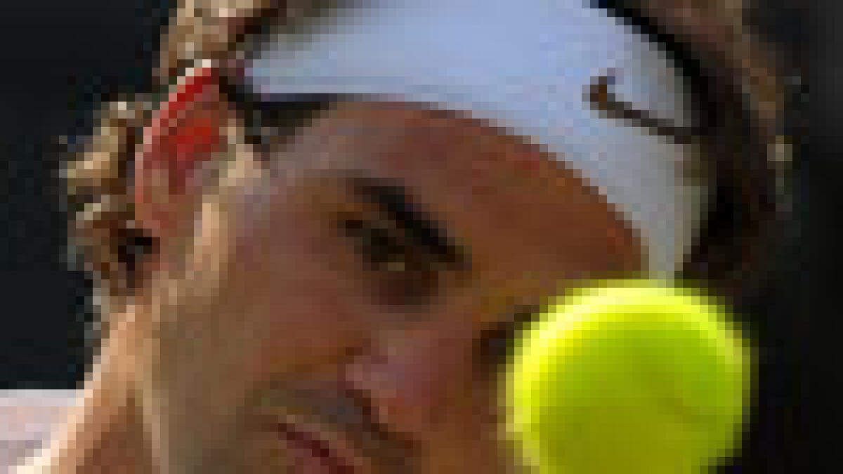 Federer enjoys easy ride to last eight