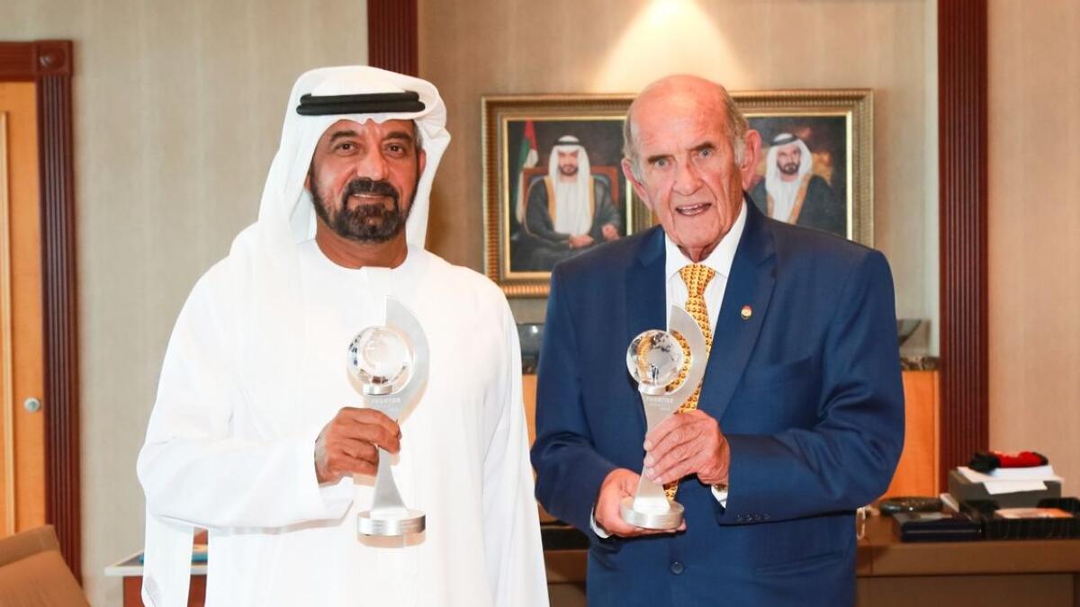 Sheikh Ahmed bin Saeed Al Maktoum and Colm McLoughlin pose with the two Frontier Awards in France. - Supplied photo