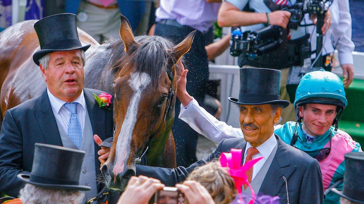 Prince Khalid Abdulla, Sir Michael Stoute.and jockey Ryan Moore with Workforce after he won the Epsom Derby. Photo focusonracing.com