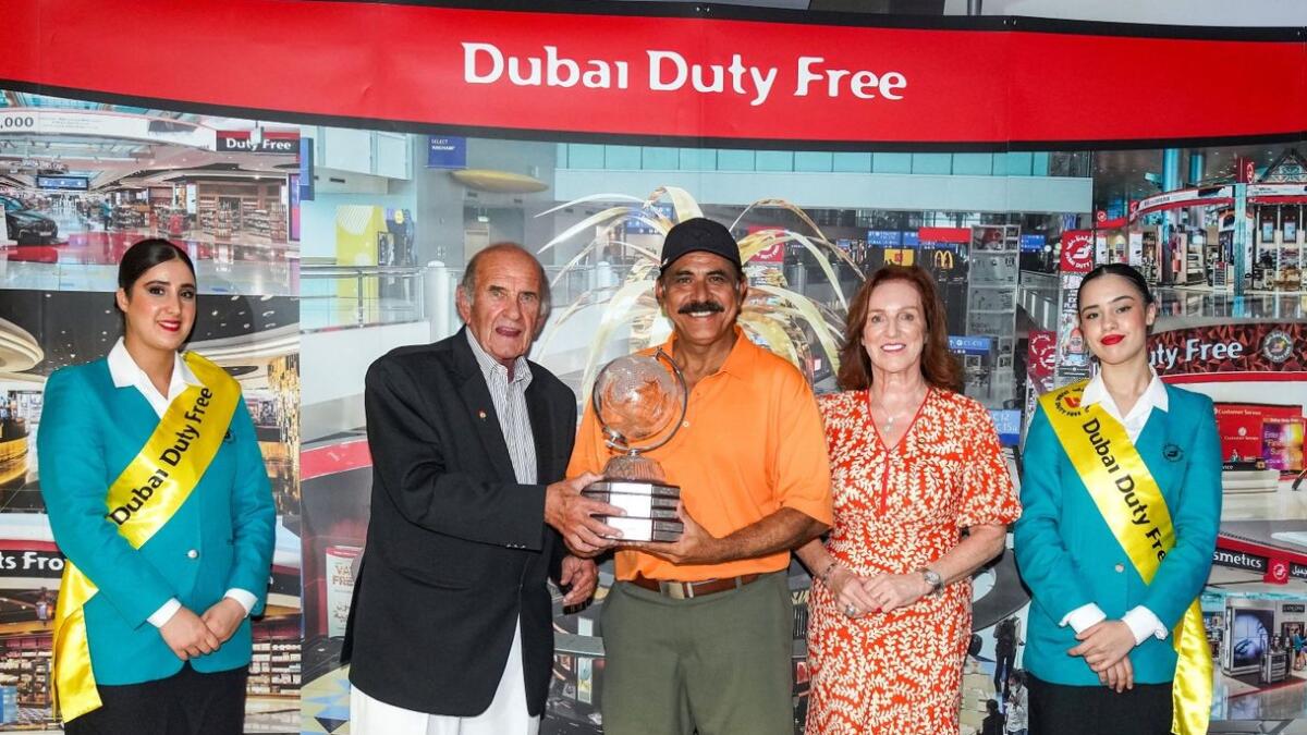 ubai Duty Free Executive Vice Chairman &amp; CEO, Colm McLoughlin along with Sinead El Sibai, SVP – Marketing presenting the trophy to Parvez Ahmed, winner of the 25th Dubai Duty Free Seniors Cup. - Supplied Photo