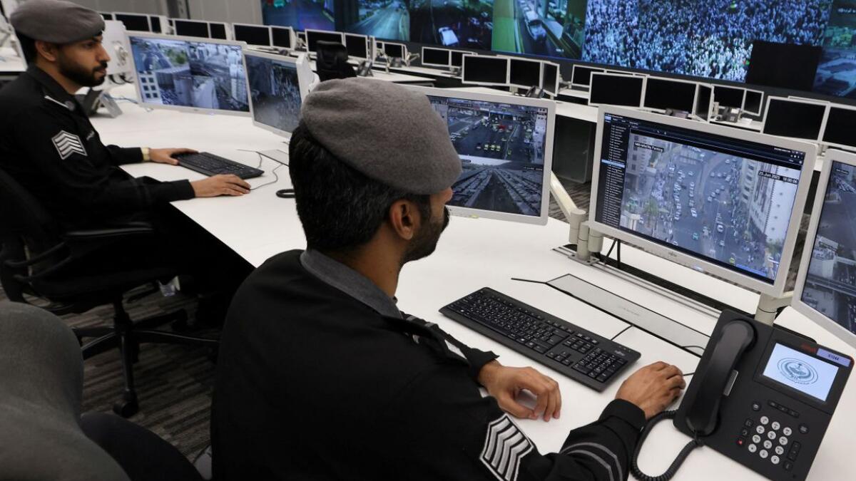 Saudi police officers monitor screens, at the 911 control centre.— Reuters file photo used for illustrative purposes