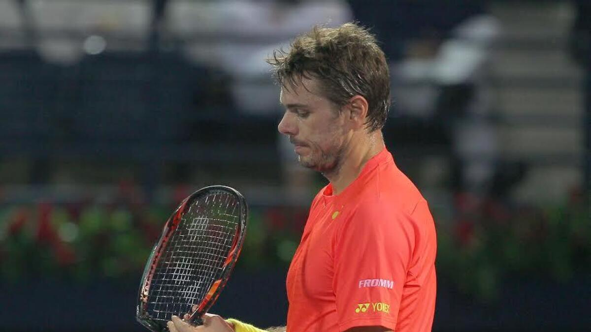 Stan Wawrinka (SUI) breaks his tennis racket in anger after losing the first set against Sergiy Stakhovsky (UKR) in the ATP Dubai Tennis Championships on Tuesday, 23 February 2016. Photo by Kiran Prasad