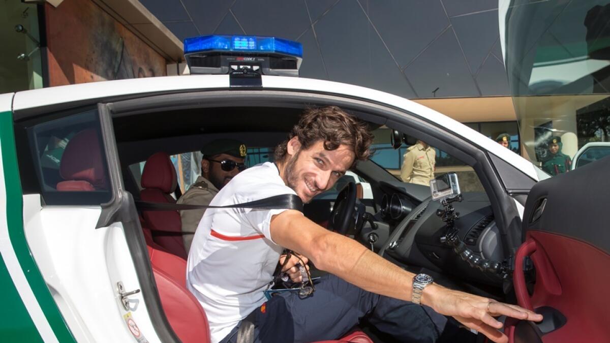 Feliciano Lopez takes a spin in Dubai Police Car. Supplied photo