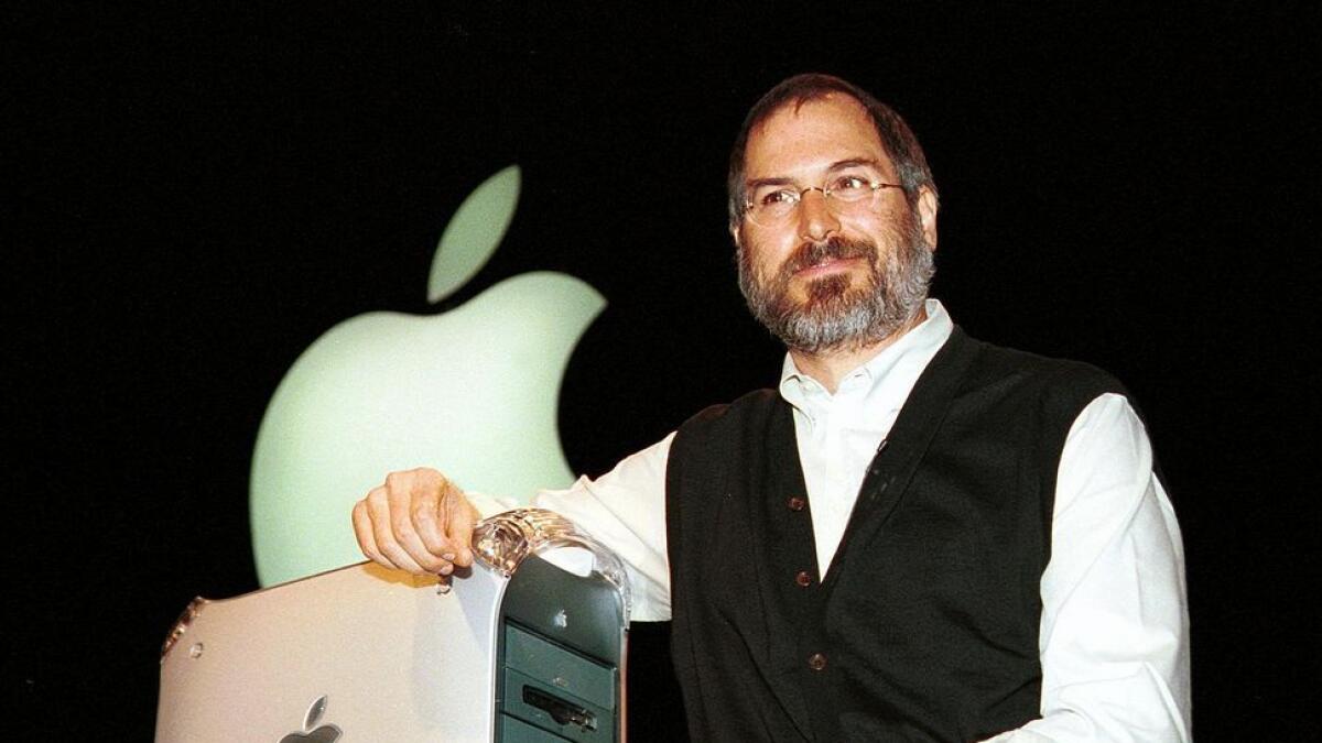 This file photo taken on August 30, 1999 shows  Steve Jobs introducing  the Power Mac G4 computer, during his keynote address at Seybold in San Francisco.