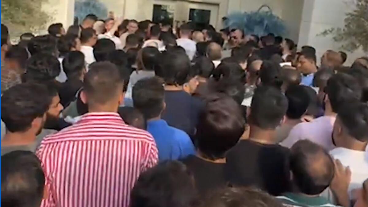 Real estate agents and potential buyers queue up outside master developer Nakheel’s head office. — Screengrab
