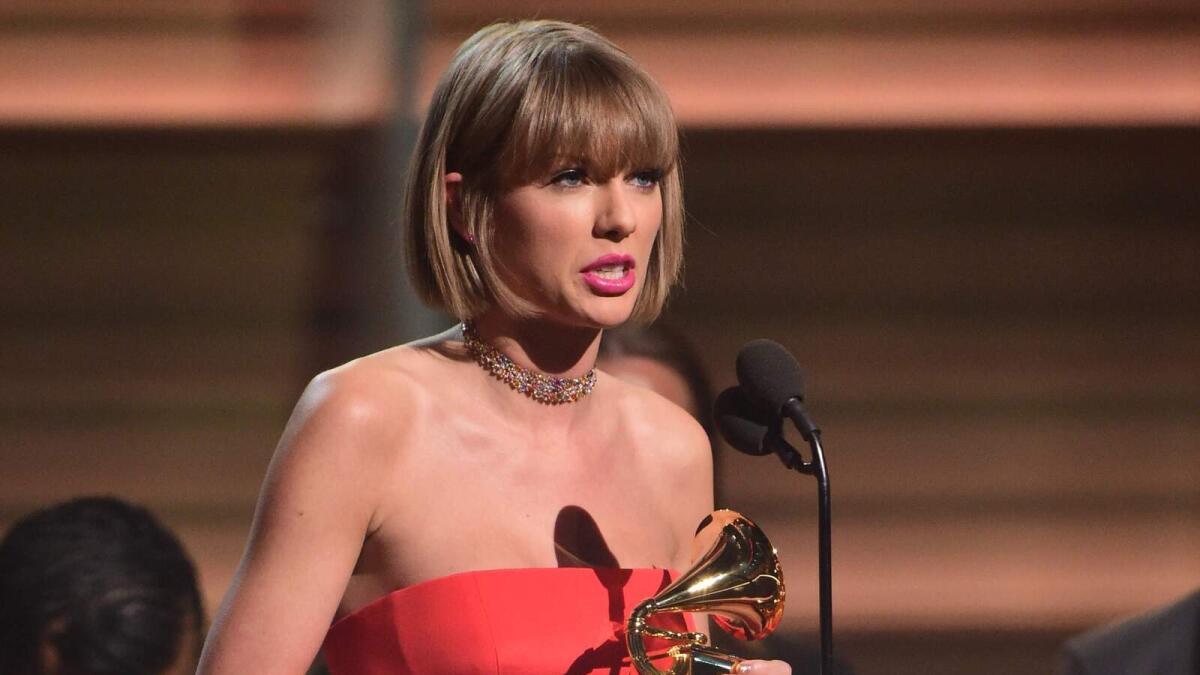 Singer Taylor Swift accepts the award for the Album of the Year onstage during the 58th Annual Grammy music Awards in Los Angeles February 15, 2016.