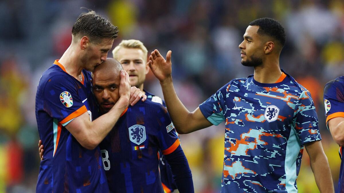 Soccer Football - Euro 2024 - Round of 16 - Romania v Netherlands - Munich Football Arena, Munich, Germany - July 2, 2024Netherlands' Cody Gakpo, Stefan de Vrij and Tijjani Reijnders celebrate after the match REUTERS/Lee Smith
