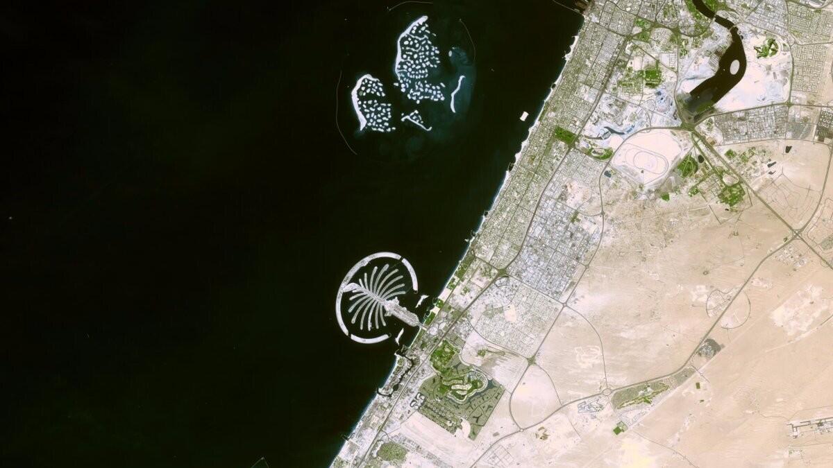 The Palm Islands and World Islands. The Dubai Canal is also visible.