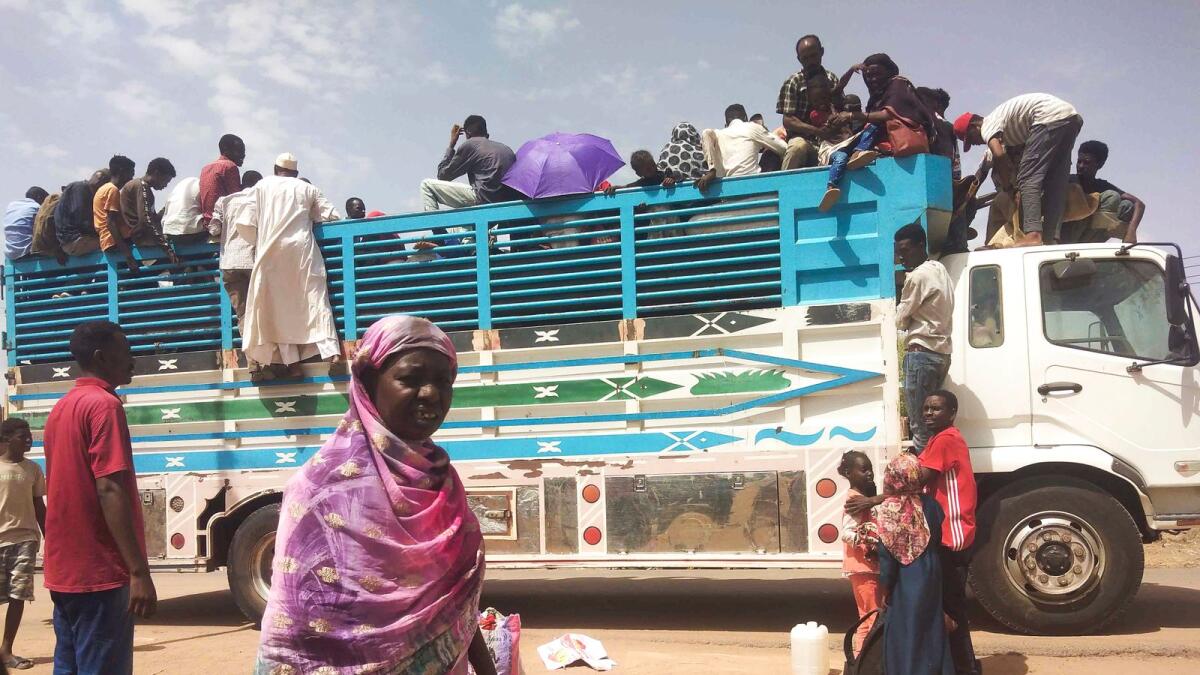 People board a truck as they leave Khartoum, Sudan, on June 19, 2023. — AP file