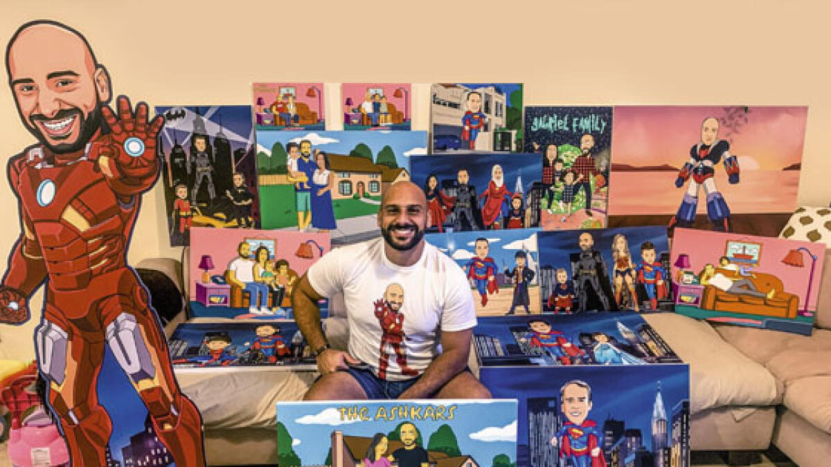 ENTREPRENEUR: Patrick Osman poses with a collection of his works