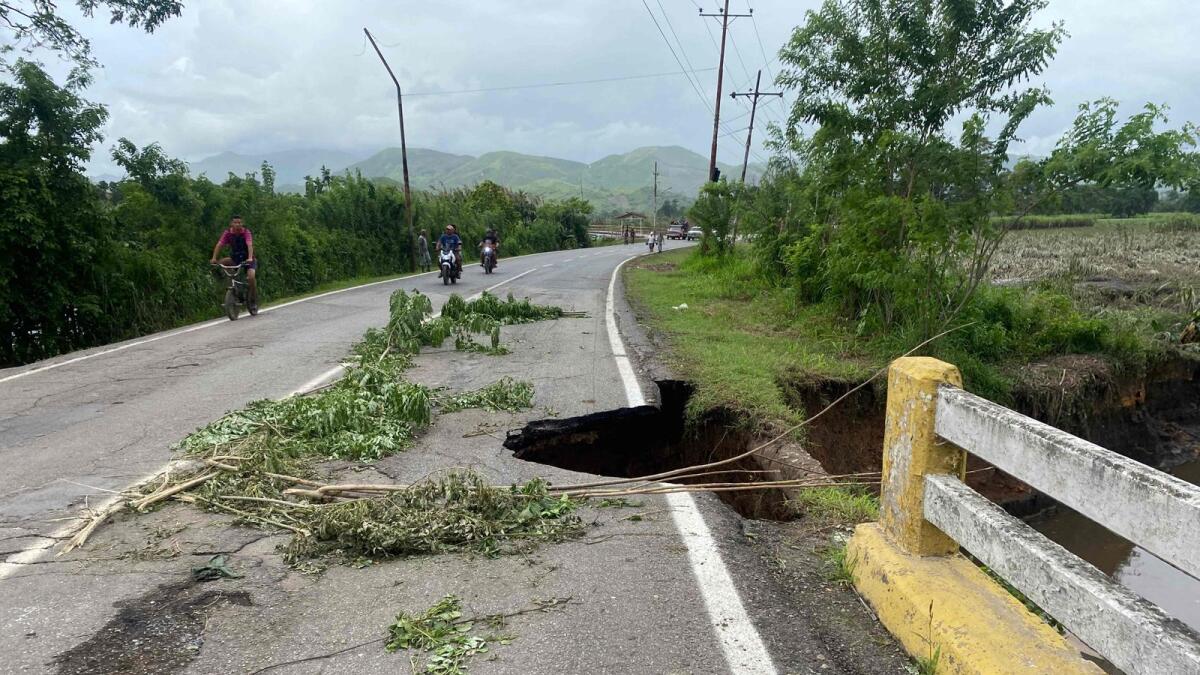 View of a damaged road after a river swelled due to heavy rain following the passage of Hurricane Beryl in Cumanacoa, Sucre State, Venezuela, on Wednesday. AFP