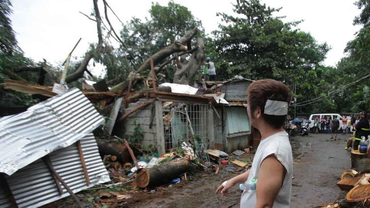 Flooded residents on rooftops as Koppu pummels Philippines