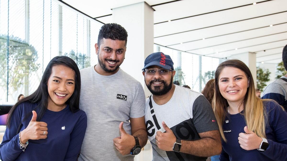 Pinkesh Jaswani, the first walk-in customer, and Amit Gopal. the first among who pre-booked to arrive, during the launch of the iPhone X at The Dubai Mall Apple Store on Friday.