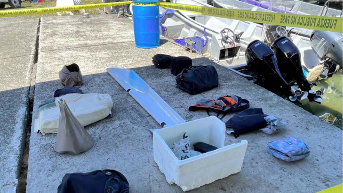 Passengers' personal belongings recovered from Caribbean waters along with pieces of the crashed twin-engine turboprop aircraft, in Limon, Costa Rica. — AP