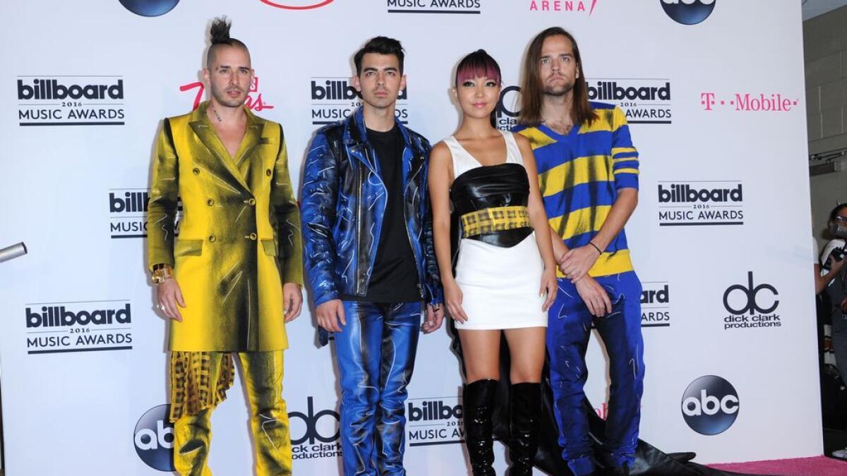 Cole Whittle, left left, Joe Jonas, JinJoo Lee and Jack Lawless pose in the press room at the Billboard Music Awards 