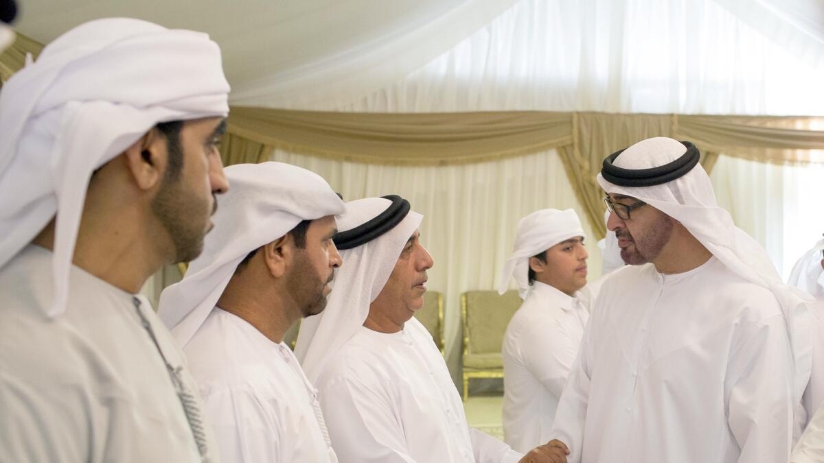Shaikh Mohammed bin Zayed offers condolences to the family of martyr Eisa Ibrahim Hamad Al Badwawi in Hatta. - Wam