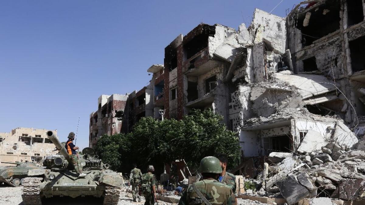 Bombers kill eight outside shrine near Syrian capital