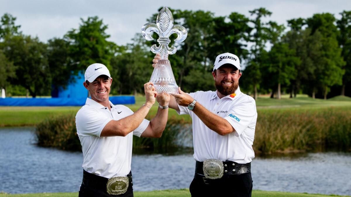 Rory McIlroy  and Shane Lowry pose for fans and the media after winning the Zurich Classic of New Orleans golf tournament. - USA TODAY Sports