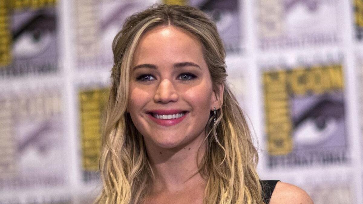 Jennifer Lawrence poses at a press line for 'The Hunger Games: Mockingjay - Part 2' during the 2015 Comic-Con International Convention in San Diego, California. 