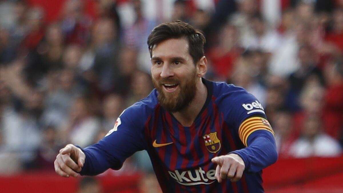 Messi downs Sevilla with 50th career hat trick