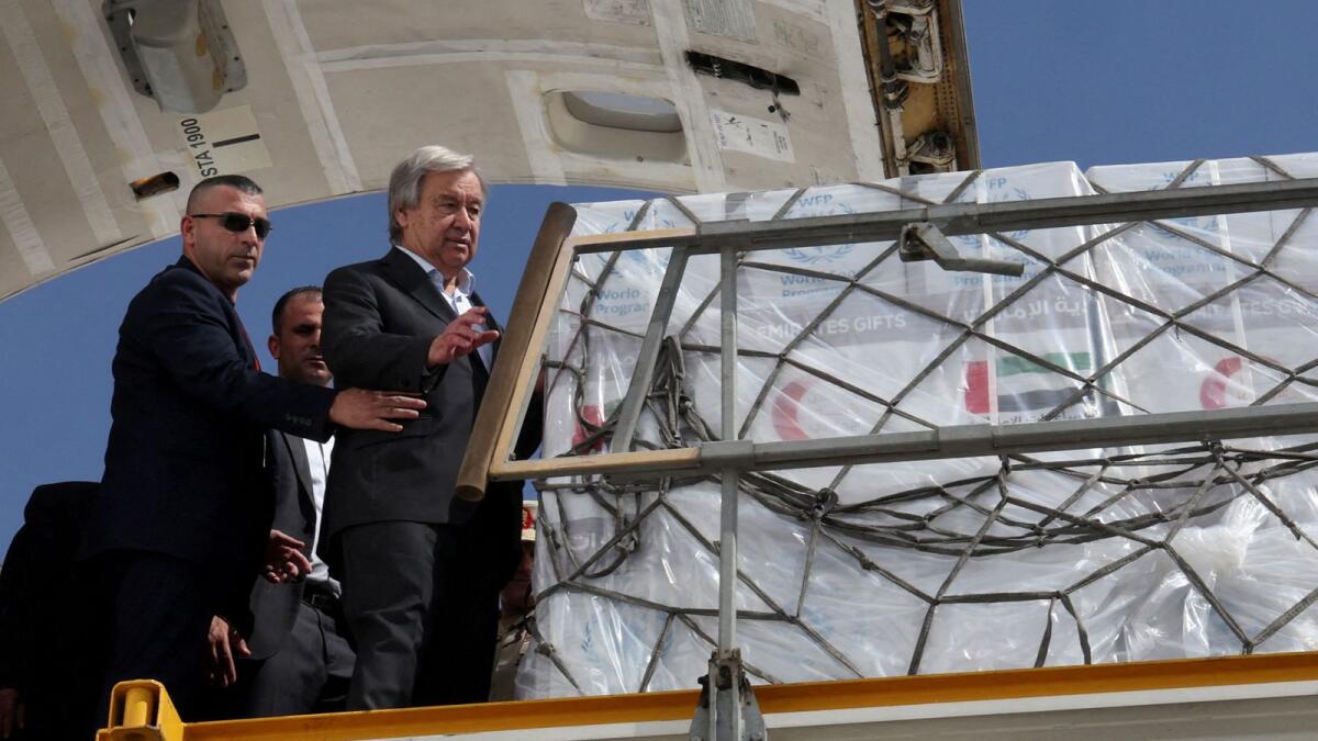 UN Secretary-General Antonio Guterres inspects aid for Palestinians, as officials wait to deliver aid to Gaza through the Rafah border crossing in Egypt on October 20. — Reuters