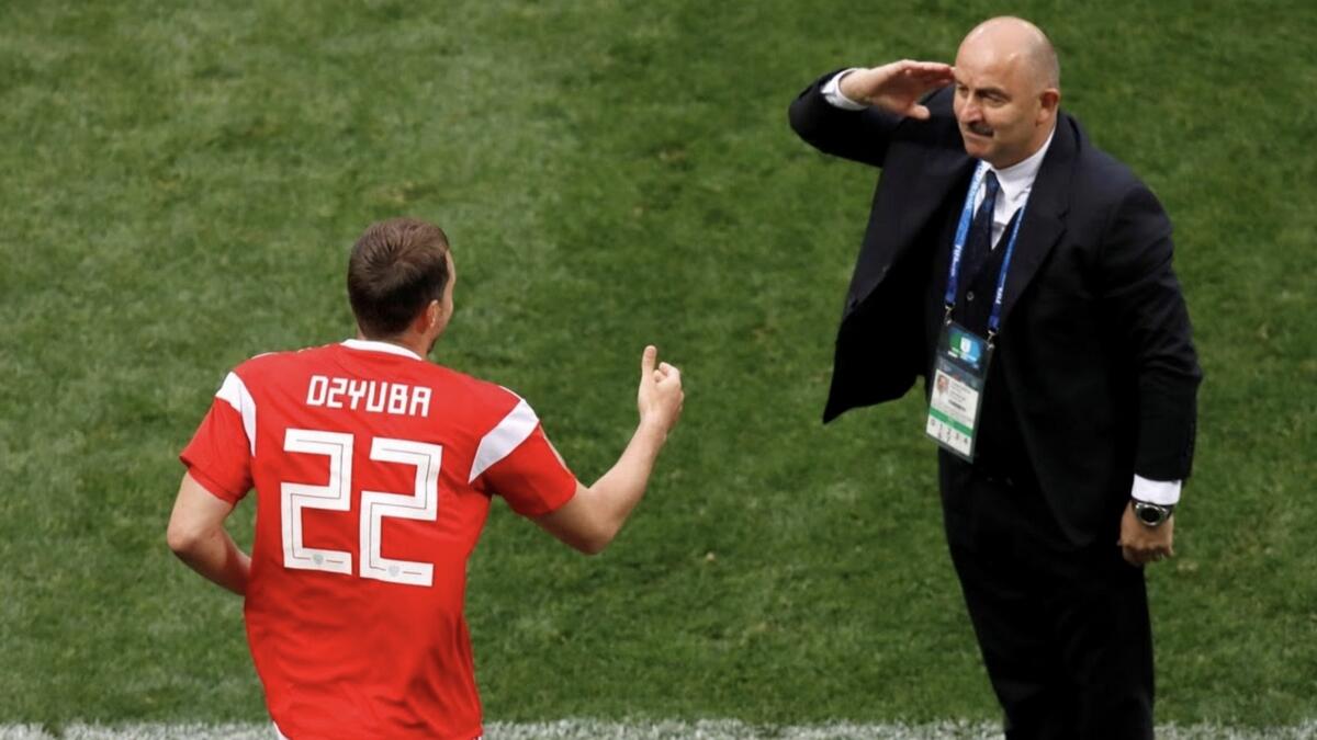 Russia coach Stanislav Cherchesov salutes Artem Dzyuba after he scored their third goal against Saudi Arabia. Reuters