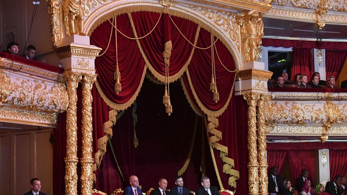 Russian President Vladimir Putin, center in the theater box, FIFA President Gianni Infantino, left in the theater box, and Director of the Bolshoi Theater Vladimir Urin, right in the theater box, attend the gala-concert.-AP