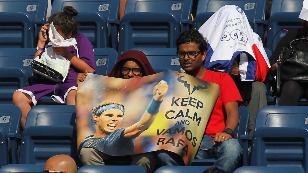 Spectators with Nadal poster at Dubai Tennis Stadium  during the Dubai Duty Free Tennis Championships at Dubai Tennis Stadium on Monday, 22 February 2016. Photo by Kiran Prasad