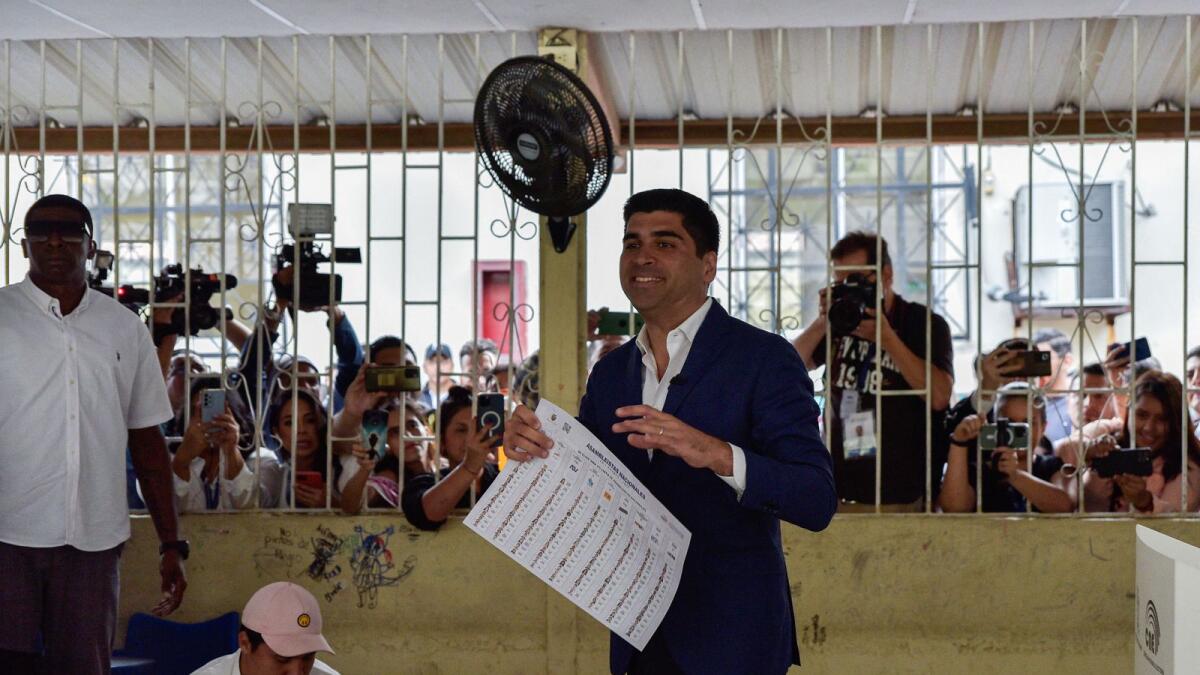 Ecuadorean presidential candidate Otto Sonnenholzner holds ballot papers at a polling station, in Guayaquil, Ecuador. — Reuters