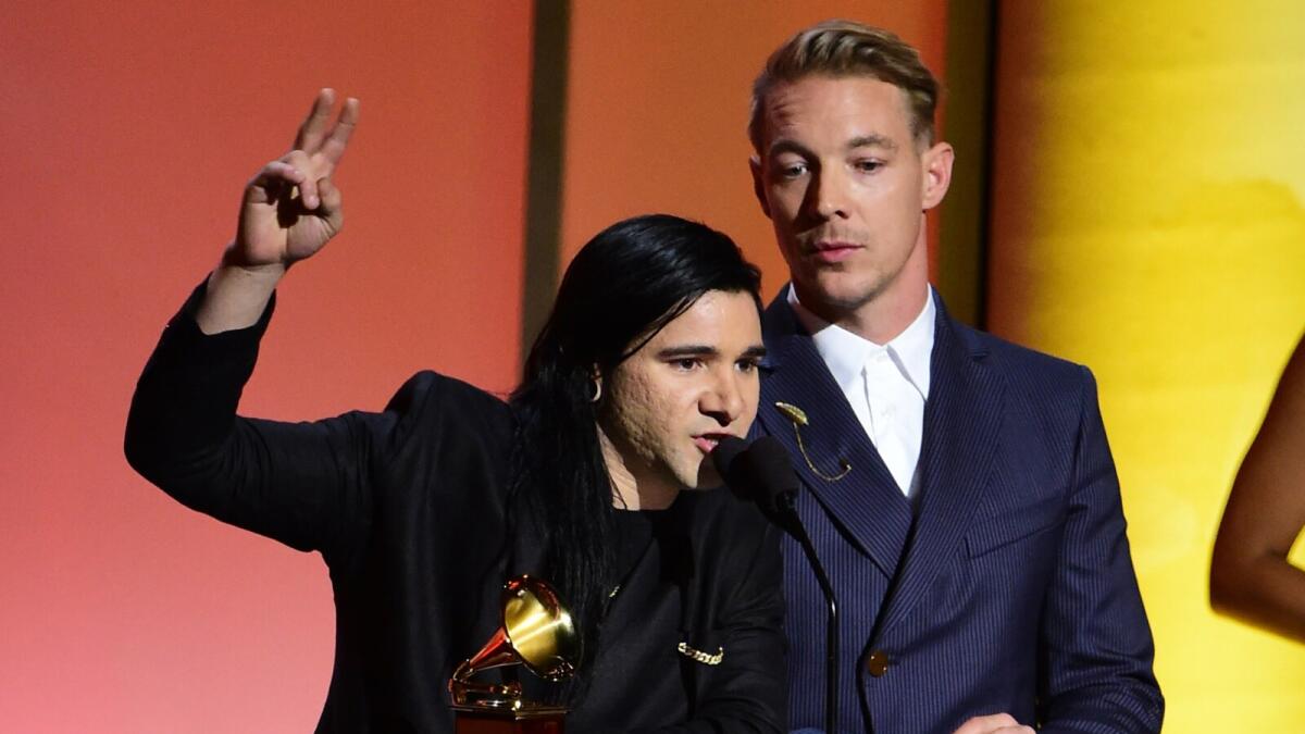 Music Producer Skrillex (L) and DJ Diplo recieve the award for the Best Dance recording, Where Are You Now onstage during the 58th Annual Grammy music Awards in Los Angeles February 15, 2016.