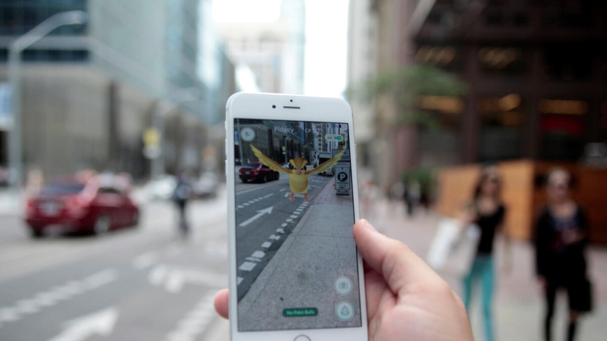 By Monday, Pokemon Go had been downloaded millions of times, topping rankings at official online shops for applications tailored for smartphones. 