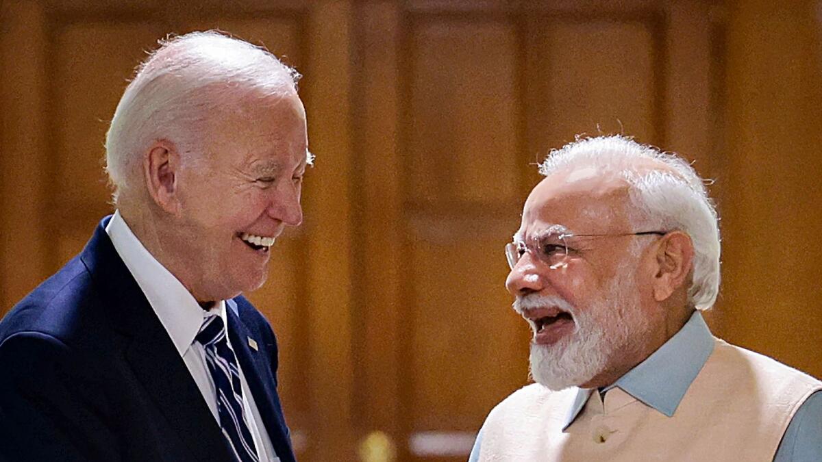 Narendra Modi with Joe Biden in New Delhi. — PTI